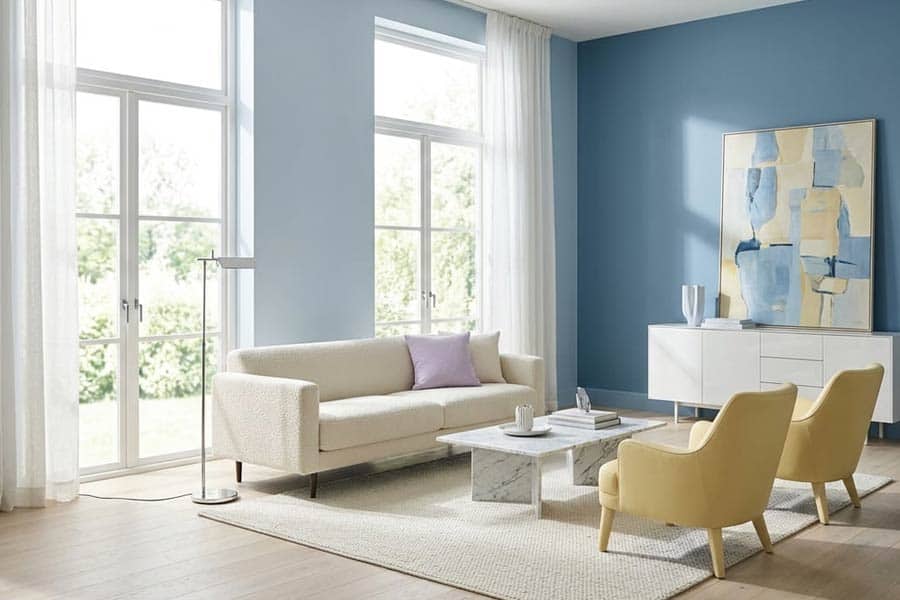 blue living room large bright windows