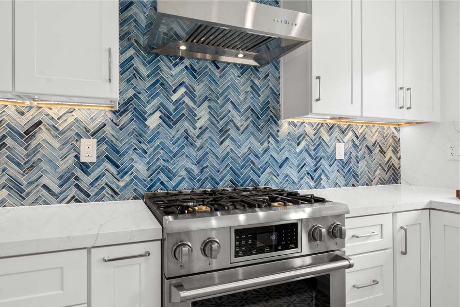 kitchen range with hood and backsplash