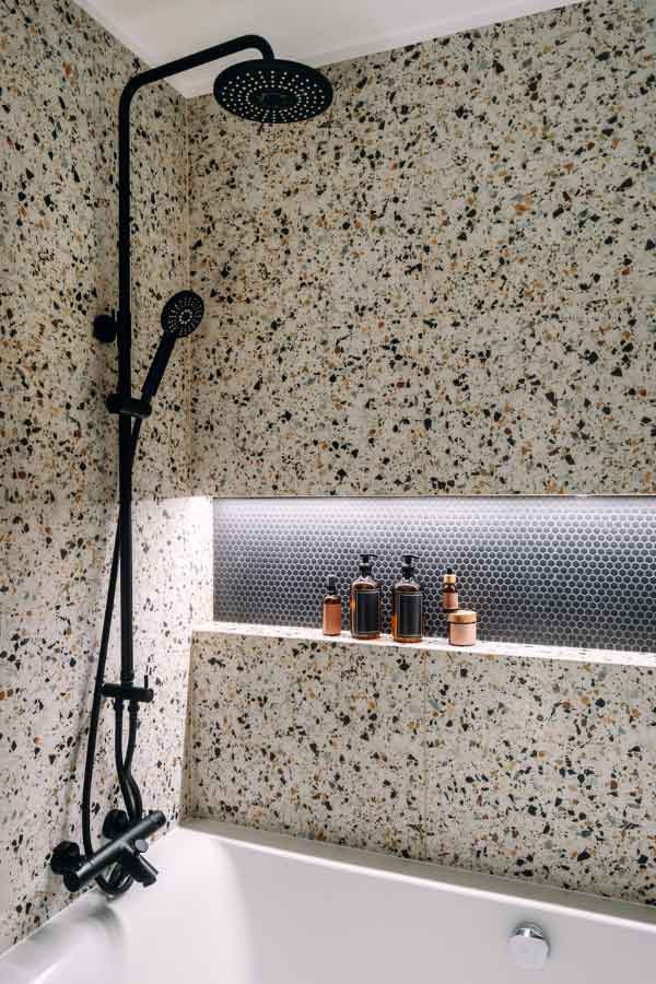modern plumbing fixtures in rennovated bathroom